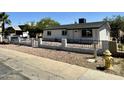 Newly renovated single story home with a landscaped front yard at 11713 W River Rd, El Mirage, AZ 85335