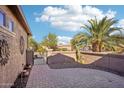 Brick paved patio with gate access and desert landscaping at 12911 W Eagle Ridge Ln, Peoria, AZ 85383