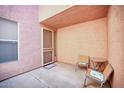 Small patio with two chairs and a table outside the front door at 1404 W Weatherby Way, Chandler, AZ 85286