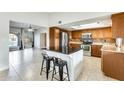 Kitchen with granite countertops and an island at 1437 W Yukon Dr, Phoenix, AZ 85027