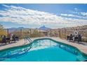 Community pool with mountain views and comfortable seating at 16333 E Lombard Pl, Fountain Hills, AZ 85268