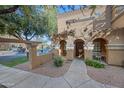 Townhouse entrance with pathway and landscaping at 1702 E Bell Rd # 130, Phoenix, AZ 85022