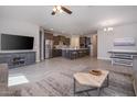 Open living space with kitchen, island, and seating area at 17669 W Daley Ln, Surprise, AZ 85387