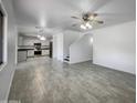 Spacious living area with tile flooring and modern ceiling fan at 2028 E Lipizzan Dr, San Tan Valley, AZ 85140