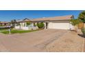 Bright white brick home with two-car garage and driveway at 2032 E Pegasus Dr, Tempe, AZ 85283