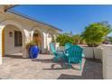 Relaxing patio area with teal chairs and large blue pot at 2032 E Pegasus Dr, Tempe, AZ 85283