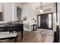 Bright and spacious entryway with a grand piano and elegant decor at 21215 N 75Th St, Scottsdale, AZ 85255