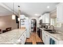 Bright kitchen features stainless steel appliances and white cabinets at 2400 E Baseline Ave # 84, Apache Junction, AZ 85119