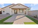 Covered patio with pavers and artificial grass, perfect for outdoor entertaining at 26706 N 174Th Ln, Surprise, AZ 85387