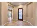 Bright entryway with tiled floors and a decorative door at 31689 N 128Th Dr, Peoria, AZ 85383