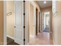 Interior hallway with neutral-toned walls and carpet at 31689 N 128Th Dr, Peoria, AZ 85383