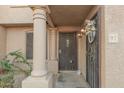 Condo entrance with wrought iron door and columns at 3491 N Arizona Ave # 98, Chandler, AZ 85225