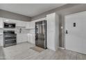 Modern kitchen with stainless steel appliances and white cabinets at 355 E Thomas Rd # B206, Phoenix, AZ 85012