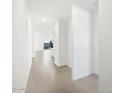 Bright hallway featuring tile flooring, leading to an open-concept living space at 4287 W Jeanette Ln, San Tan Valley, AZ 85144