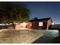 Night view of a single-story home with a yard at 4417 N 70Th Ave, Phoenix, AZ 85033