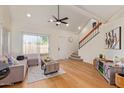 Cozy living room with vaulted ceilings, light-colored wood floors, and access to the stairway at 7326 N 43Rd Ave, Glendale, AZ 85301