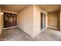 Front entry with double doors and sliding glass door to patio at 7837 E Crestwood Way, Scottsdale, AZ 85250