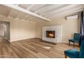 Living room with a fireplace and light wood floors at 8019 N 14Th St, Phoenix, AZ 85020