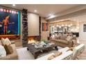 Open living area featuring a fireplace and view into the kitchen at 13801 N Moon Dr, Phoenix, AZ 85023