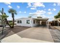 Well-maintained manufactured home with carport and desert landscaping at 16230 N 35Th Way, Phoenix, AZ 85032