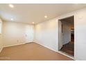 Bright laundry room with light brown flooring and access to other rooms at 16230 N 35Th Way, Phoenix, AZ 85032