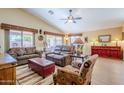 Relaxing living room featuring comfortable leather sofas and wood flooring at 17065 N Silver Path, Surprise, AZ 85374