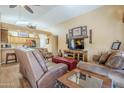 Open-concept living room with a view of the kitchen at 17065 N Silver Path, Surprise, AZ 85374