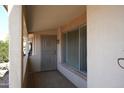 Covered front porch with tile flooring and security door at 17407 N Country Club N Dr, Sun City, AZ 85373