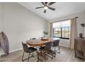 Bright dining area with wooden table and seating for six at 17600 N 64Th Dr, Glendale, AZ 85308