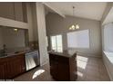 Kitchen with an island, stainless steel appliances, and ample cabinet space at 2255 W Rose Garden Ln, Phoenix, AZ 85027