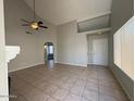 Bright and spacious living room with tile flooring and a ceiling fan at 2255 W Rose Garden Ln, Phoenix, AZ 85027