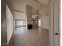 Spacious living room featuring high ceilings and tile floors at 2255 W Rose Garden Ln, Phoenix, AZ 85027