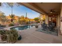 Relaxing backyard oasis with a sparkling pool and patio at 2310 W Hazelhurst Dr, Anthem, AZ 85086