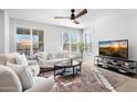 Bright living room features a neutral palette and cozy seating at 2425 W Bronco Butte Trl # 1032, Phoenix, AZ 85085