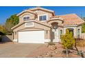 Two-story house with a two-car garage and well-maintained landscaping at 3210 E Brookwood Ct, Phoenix, AZ 85048