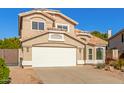 Two-story house with a two-car garage and well-maintained landscaping at 3210 E Brookwood Ct, Phoenix, AZ 85048