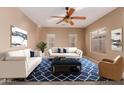 Living room featuring a stylish rug and comfortable seating area at 41705 N Globe Ct, Phoenix, AZ 85086