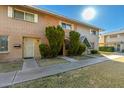 Front view of a brick townhouse, showcasing its landscaping and walkway at 5005 S Mill Ave, Tempe, AZ 85282