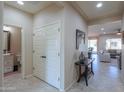 Hallway with powder room, coat closet, and view of living area at 5845 N Turquoise Ln, Eloy, AZ 85131