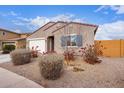 Charming one-story home with drought-tolerant landscaping at 670 E Wiley Way, Casa Grande, AZ 85122