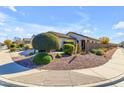 Single-story home with landscaped yard and desert landscaping at 7325 W Pleasant Oak Way, Florence, AZ 85132