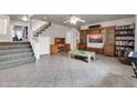 Gathering room with tiled floors and built-in shelving at 906 N Swan Dr, Gilbert, AZ 85234