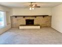 Living room with fireplace and ceiling fan at 914 N 40Th Ave, Phoenix, AZ 85009