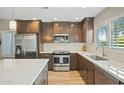 Modern kitchen with stainless steel appliances and quartz countertops at 9230 N 104Th Pl, Scottsdale, AZ 85258