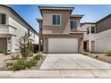 Inviting two-story home boasts a wide driveway, neutral stucco, well-placed landscaping, and a convenient two-car garage at 9358 E Sequence Ave, Mesa, AZ 85212