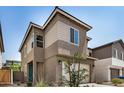 Attractive home exterior with a large garage, neutral stucco, and meticulous landscaping creating an inviting curb appeal at 9358 E Sequence Ave, Mesa, AZ 85212