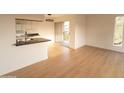 Bright living room with light wood floors and access to balcony at 14806 N Yerba Buena Way # D, Fountain Hills, AZ 85268