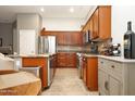 Spacious kitchen featuring granite countertops and modern wood cabinets at 18176 W Paradise Ln, Surprise, AZ 85388