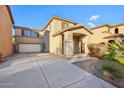 Two-story house with a two-car garage and desert landscaping at 18536 W Douglas Way, Surprise, AZ 85374