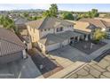 An aerial view of a beautiful two-story home with a three-car garage at 2338 N 112Th Ln, Avondale, AZ 85392